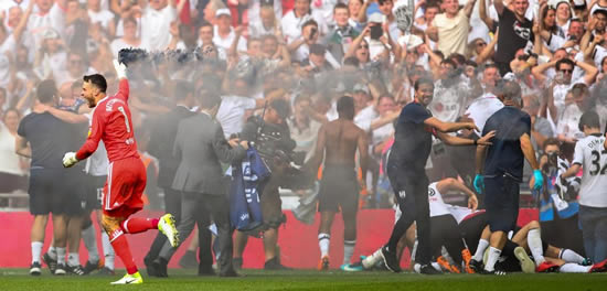 Fulham goalkeeper Marcus Bettinelli celebrates Premier League promotion with flare and dance