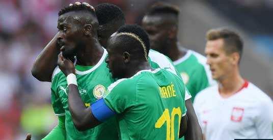 Poland 1 Senegal 2: Good fortune and bad errors hand Africans Group H win