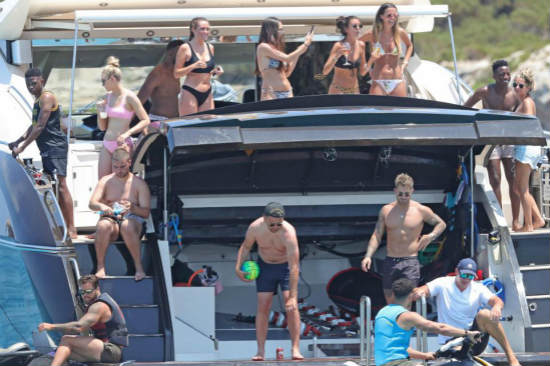 Luke Shaw relaxes on luxury yacht with group of stunning girls as Manchester United ace enjoys downtime in Ibiza