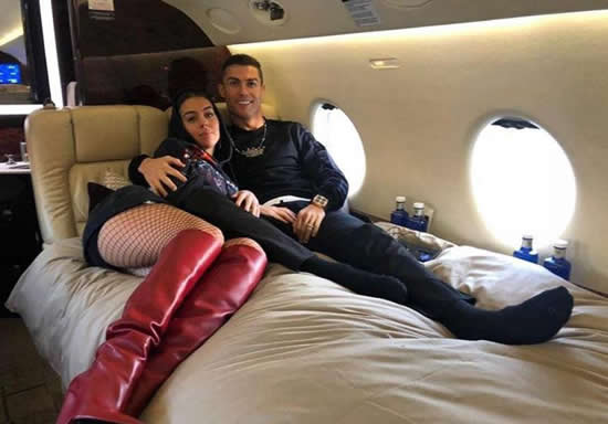 Cristiano Ronaldo’s ‘fiancee’ Georgina Rodriguez sizzles in fishnet stockings as the pair pose on bed on board private jet
