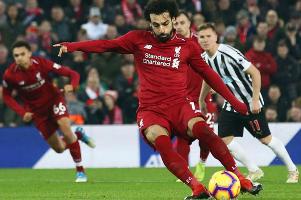 Liverpool 4 Newcastle United 0: Salah strikes again to punish City loss as Klopp reaches 100 wins