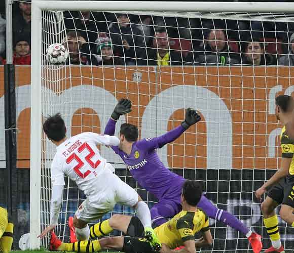 Augsburg 2 Borussia Dortmund 1: Bavarians boost neighbours Bayern in Bundesliga title race