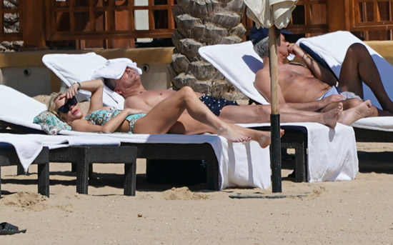 ONE SPECIAL FRIEND Married footie boss Jose Mourinho spotted on a sunshine break with special female friend