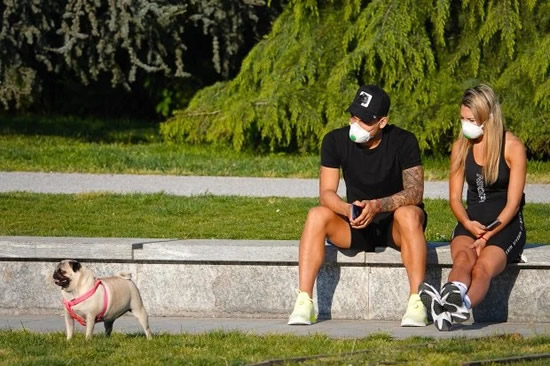 Barcelona transfer target Lautaro Martinez and stunning Wag Agustina Gandolfo wear masks to take dog for walk in Milan