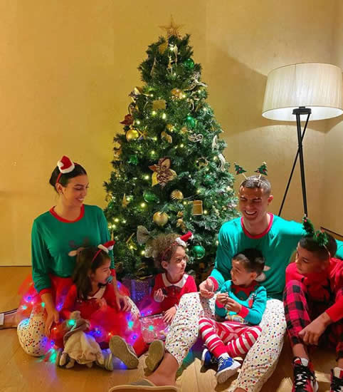 CRISTMAS CHEER Cristiano Ronaldo and Georgina Rodriguez share heartwarming snap of family in front of Xmas tree