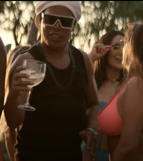 Ronaldinho stars in music video featuring half-naked models as Brazilian changes career