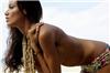 Selita Ebanks needs a rest after a long day of looking pretty on a beach