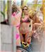 Bagging a bargain ... Kelly Brook buys a colourful bikini from a beach vendor