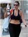 Revealing ... sweaty Imogen pounds the streets in crop top and see-through leggings