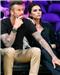 Above: David Beckham sat with his hand on Victoria's leg through the Lakers game