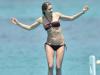Water babe ... Charlotte Jackson looks stunning in her maroon bikini