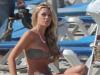 Stunning... Abbey Clancy relaxes on beach