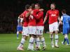 Rooney is congratulated by his team-mates as it was he who created the goal.