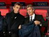 However manager Manuel Pellegrini, right, and his assistant Ruben Cousillas are made of sterner stuff