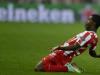 Joel Campbell skids across the turf on his knees after scoring Olympiakos' second goal of the game