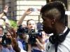 Paul Pogba, who could potentially be playing his last game for Juve with the midfielder linked with a host of clubs this summer, waves to fans outside the Regent hotel in Berlin. 