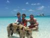Manchester United star Wayne Rooney provided one of the best holiday snaps as he posed for a family shot with a pig while on holiday in the Bahamas