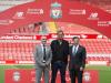 Jurgen Klopp poses on the pitch with Ian Ayre and Tom Werner
