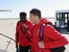 Kolo Toure and Lucas Leiva in deep conversation as they head to the plane