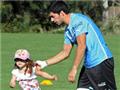  Family matters for Suarez as daughter pals up with Kop star during Uruguay training 