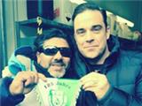  Robbie Williams finds Diego Maradona up a mountain... but it turns out the man is just a (very good) lookalike of Argentina great 