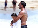  Carlos Tevez tries to get over Argentina World Cup snub with family holiday on Miami Beach 