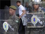  England squad arrive at Rio hotel in Brazil to be greeted by ranks of riot police 