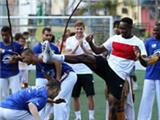  Slumdogs and Millionaires: Football stars meet children from Rio slums 