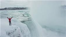 Climber ascends frozen sections of Niagara Falls