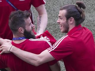  DRAGON PLAY Wales players laugh and joke in utterly relaxed walk around the Lyon pitch ahead of Euro 2016 semi-final with Portugal 