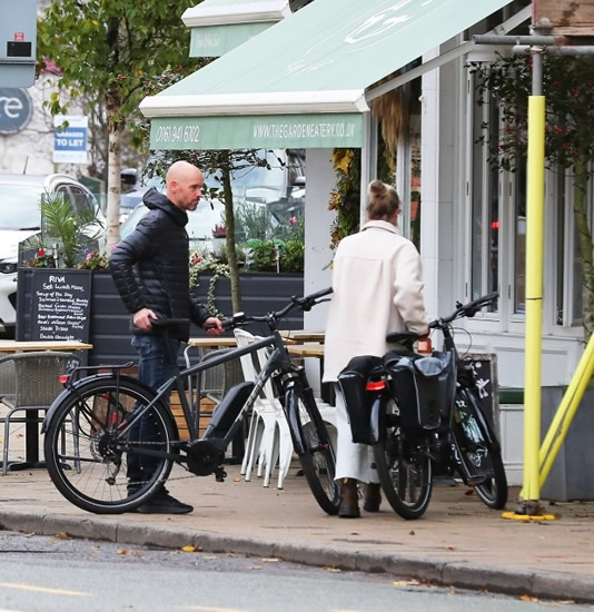 RED-Y TO ROLL Notorious Man Utd taskmaster Ten Hag takes time out of gruelling club rebuild to visit cafe with wife on ELECTRIC bike