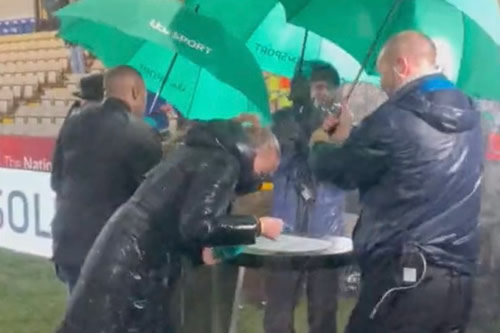 Laura Woods gets absolutely soaked as rain l
