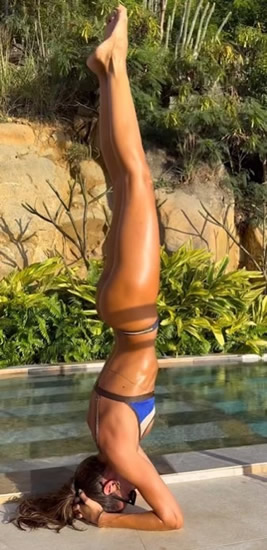 Sex-mad Germany Wag Izabel Goulart shows off bum and amazing figure doing headstand in barely-there bikini by pool