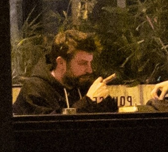 Cheating' Pique looks miserable as he's spotted smoking a cigar in Paris cafe after being slammed by Shakira in new song