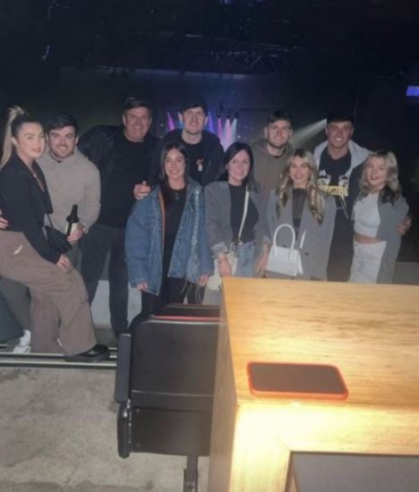 HAPPY AS HARRY Harry Maguire meets Tom Grennan backstage as Man Utd star and wife Fern enjoy night out at concert