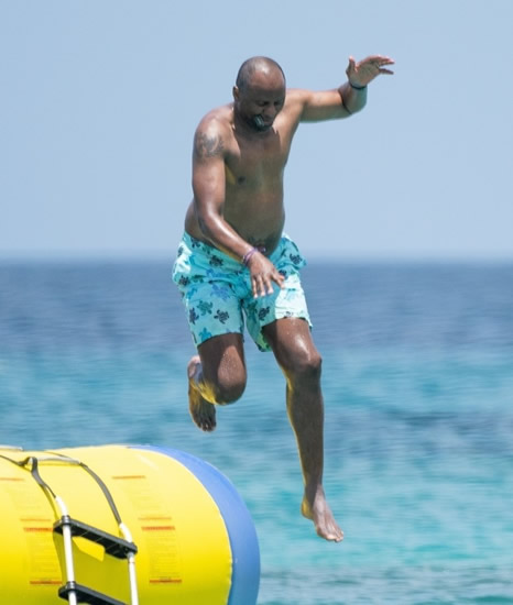 PAT'S GOOD Arsenal legend Patrick Vieira shows off belly tattoo as he relaxes in Barbados amid talk of return to Premier League