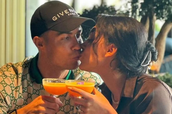 Cristiano Ronaldo and Georgina Rodriguez kiss and say 'cheers to love' after she denies claims he is 'fed up with her'