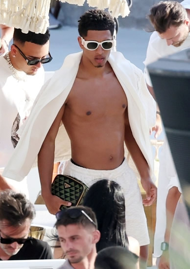 BELLI OUT Topless Jude Bellingham relaxes at trendy beach club in Mykonos ahead of £115m Real Madrid transfer