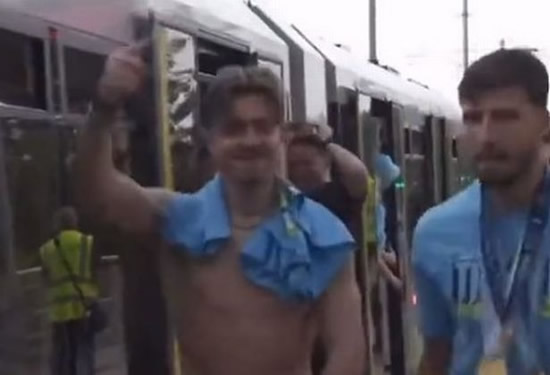 Topless Jack Grealish can't stop smiling as Man City star celebrates on tram