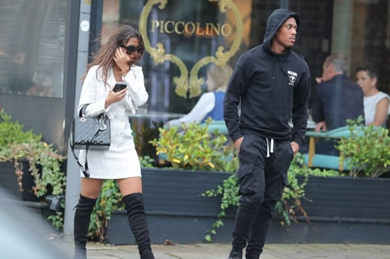 HOT DATE? Man Utd star Anthony Martial wears black hoodie as he’s spotted leaving restaurant with glamorous mystery woman