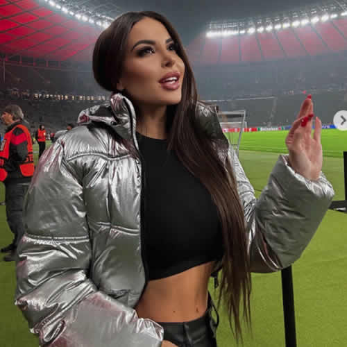 Glamorous football presenter and Kim Kardashian lookalike wows in bold outfit for Champions League clash