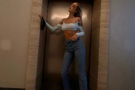 'World's sexiest WAG' dons scorching hot outfit in lift and has fans 'going up'