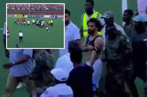 Mo Salah protected by army as punches thrown between security and pitch invaders in shocking scenes during Egypt clash