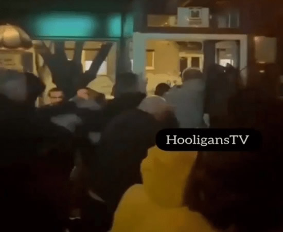 HOOLIE CLASH Shocking moment Red Star hooligans storm Man City bar and beat supporters with sticks ahead of Champions League clash