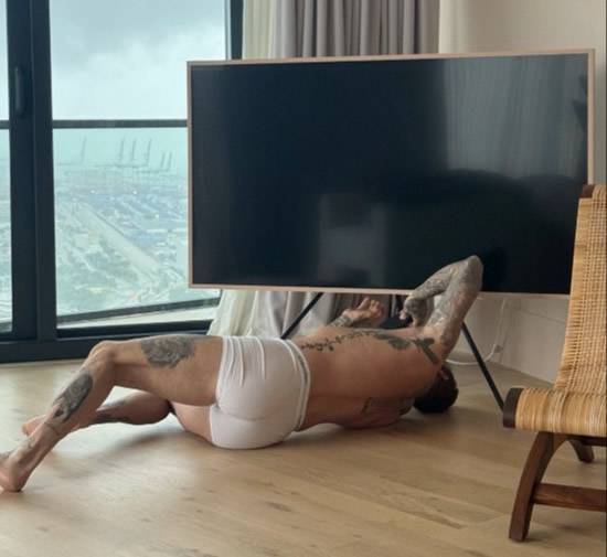 BECKS APPEAL Man Utd legend David Beckham fixes TV in just his boxers as wife Victoria tells fans ‘you’re welcome’