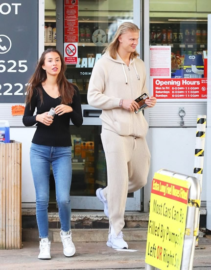 IS IT FULL YET? Erling Haaland lets his hair down as girlfriend Isabel fills up their £300,000 Rolls Royce at petrol station
