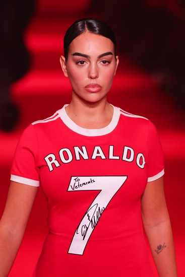 LADY IN RED Georgina Rodriguez stuns in red dress at Paris Fashion Week… with huge nod to Cristiano Ronaldo’s Man Utd days