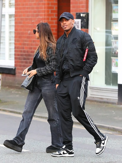 MARTIAL HEART Man Utd star Anthony Martial takes a stroll with glamorous mystery woman as pair wear matching all black outfits