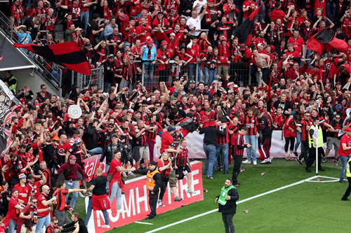 Fans storm pitch as pandemonium erupts as Leverkusen finally secure historic Bundesliga