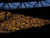 The Dortmund fans enjoy the action whilst bathed in the beautiful early evening sunshine